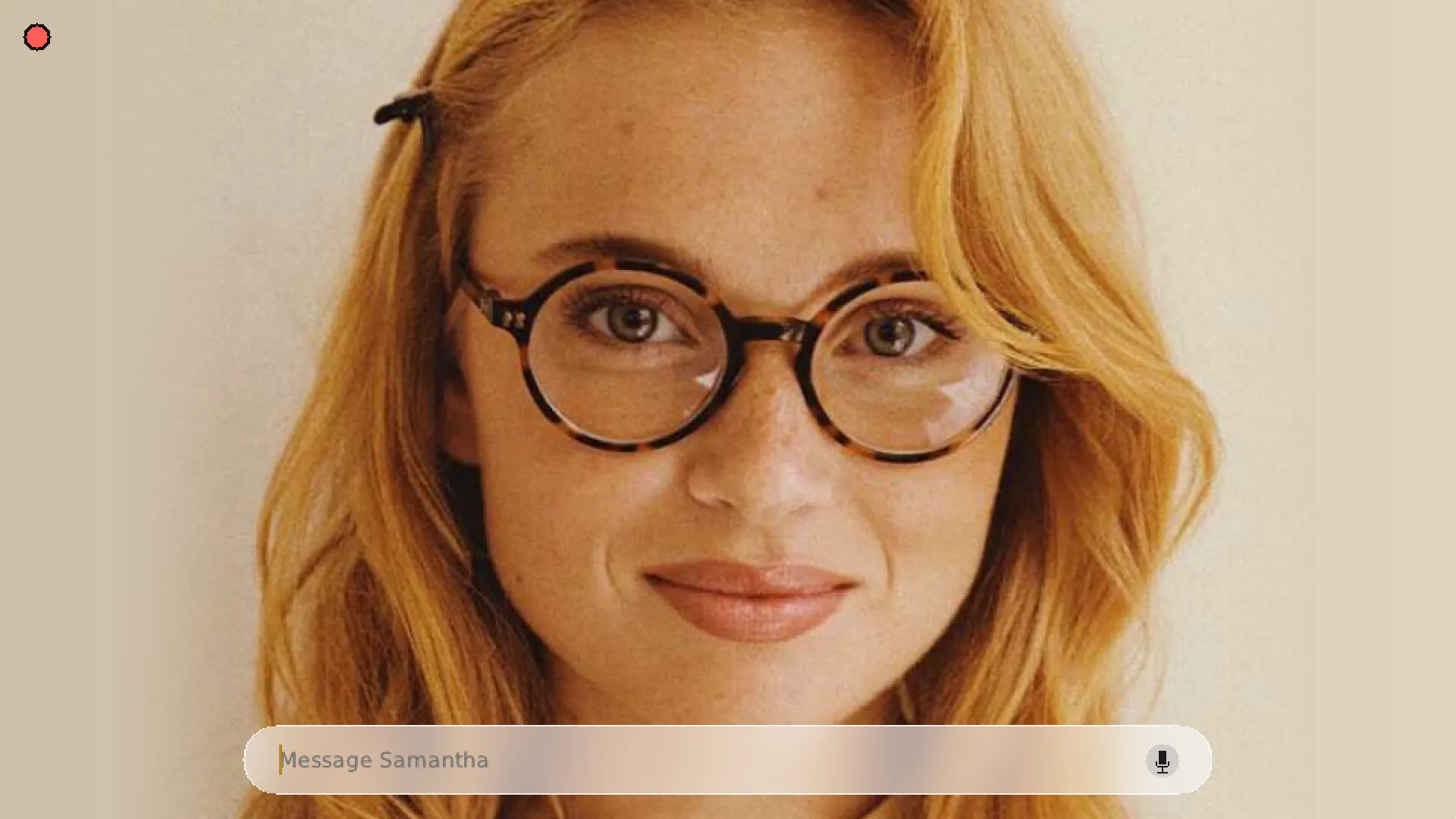 Samantha's face, full screen, with a chat bar at the bottom